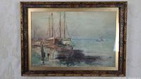 Frontal view of the framed watercolor showing three sailing vessels docked, the pier and calm water with a distant boat, highlighting the signature and date on the artwork.