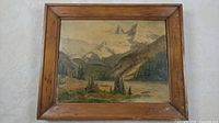 Frontal photo of framed 14 x 18 inch oil on canvas mountain landscape painting by J. Dickinson showing the full artwork and wooden frame.