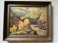 Framed varnished print on Masonite of a coastal spring landscape by Rudolph Anton Messner. Colorful nature scene with mountains, river, and trees.