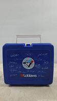 Front view of blue lunch pail with Toronto Blue Jays logo and white signature prints, white handle, and Loblaws logo at bottom center.