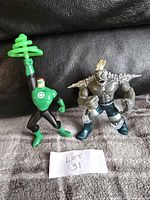 Both action figures displayed side by side showing full body from front