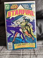 Front cover of Starfire comic book issue #6 showing Starfire fighting sinister purple shadowy demons with bright and bold colors and text.