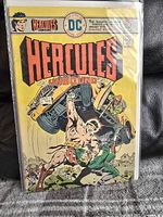 Photo of Hercules Unbound Comic #4, bagged and boarded, showing colorful cover with Hercules lifting vehicle and fighting enemies.