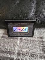 Front view of the Panini Anthology Matt Puempel autographed hockey card, showing the signature and holographic background.