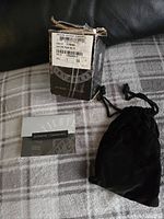 Photo showing the original box of the Upper Deck hockey puck, with heavy taping and some wear.