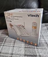 Photo of the VTech corded and cordless telephone system original box showing front with images of phones included.