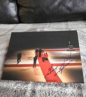 First signed photograph of Montreal Canadiens rink with players and Stanley Cup, blue signature of Dickie Moore
