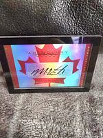 Front view of Panini Anthology hockey card featuring Mark Visentin's autograph on a holographic maple leaf design.