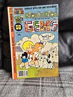 Front cover image showing Richie Rich Gems comic book #25 with characters and bright colors.