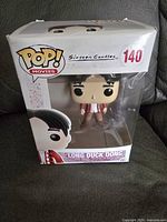 Front view of the Long Duck Dong Funko Pop figure in its original box, showing packaging and figure details.