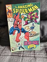 Photo of the comic book The Amazing Spider-Man issue #5 featuring the Montreal Expos baseball team on the cover with Spider-Man and Green Goblin in a baseball game scene.