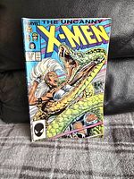 Front cover of The Uncanny X-Men comic book issue #223 showing Storm and a large snake.
