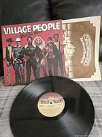 Vinyl record and cover for Village People Macho Man album, with original Casablanca Records inner sleeve visible.