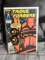 Front cover of a Transformers comic book issue 58 by Marvel, bagged and boarded, showing detailed artwork of a Transformer face.