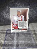 Front of Rod Brind'Amour Upper Deck SP Authentic Fabrics jersey card showing player's image and embedded fabric piece.
