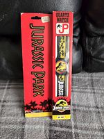 Front of the vintage Jurassic Park quartz watch in original packaging showing Jurassic Park branding and watch face.