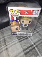 Front view of new Jerry "The King" Lawler WWE Funko Pop figure, in protective sleeve, showing packaging with number 97 and character illustration.