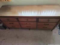 Top view showing rectangular wood surface with glossy finish on the dresser.