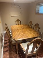 Overview of rectangular table and six chairs in room