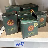 Six original boxed Boyd's Bears Bearstone figurine boxes stacked together showing branded packaging and collectible series info.