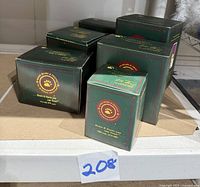 Six boxed Boyd's Bears from The Bearstone Collection showing original packaging with green boxes, logos, and labeling.