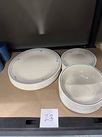 Stacked set of Corelle plates and bowls showing quantity and design.