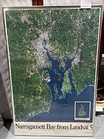 Full view of framed poster showing Narragansett Bay aerial photo with text 'Narragansett Bay from Landsat 5' at bottom.