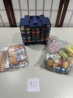 Overview of all items including the ink pad holder, paper punches, and magnetic photo pockets on a table.