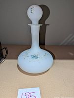 Full view of antique Mt. Washington satin glass decanter bottle with stopper featuring hand-painted floral design.