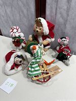 Photo showing six Annalee Christmas animal figurines including mouse in bag, Santa bear, and others.