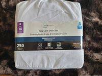 Packaged white sheet set showing Mainstays brand, king size label, 250 thread count and 4-piece set info.