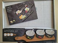Photo of boxed Bowring Cheese Serving Board and Appetizer Set boxes showing product labels and packaging.