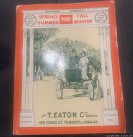 Front cover of the 1901 Spring & Summer and Fall & Winter T. Eaton Co. Limited reprint catalogue showing vintage illustration and orange border