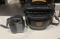 Sony CCD-SC5 Handycam and Solidex camera bag side by side on a white surface