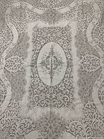 Top-down view of the rectangular off-white vintage lace tablecloth showcasing its central oval medallion and surrounding intricate floral lace patterns.