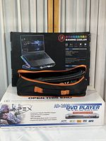 Photo of the gaming laptop cooler in carrying bag with box behind