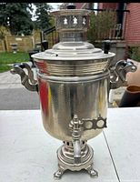 Front view of samovar showing body, handles and spigot