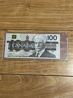 Front side of the banknote showing Sir Robert Borden portrait, 100 denomination, and signatures.