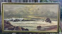 Full view of the framed seascape painting showing the stormy ocean waves and sky with seagull.