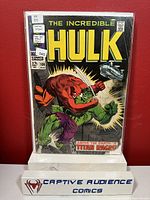 Photo of The Incredible Hulk #106 comic book in protective sleeve showing full front cover with rating and sticker noting corner chew and grade of GD.