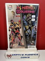 Front cover of Ms. Marvel & Wolverine #1 in a plastic protective sleeve, showing vibrant character artwork and labeled with issue number and variant information.