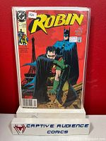 Comic book 'Robin #1' 1st Lynx Newsstand Edition in protective sleeve on display stand.