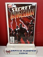 Photo of Secret Invasion #1 comic book in protective sleeve showing front cover with Marvel logo, title, and price sticker.