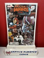 Photo of Secret Wars #6 1:20 Variant cover showing comic in protective sleeve with backing board and price sticker.