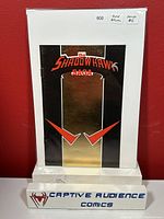 Photo of The Shadowhawk Saga Gold Ashcan comic book in protective sleeve with clear labeling showing issue price $6 and condition as gold edition.