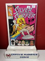 Silver Surfer #1 comic book in a protective sleeve with VF+ grade sticker and price tag visible.