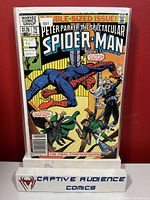 Photo of Spectacular Spider-Man #75 comic book in FN/VF condition with newsstand label and clear cover sleeve.