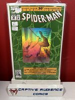 Photo of the sealed Spider-Man #26 comic book showing the 30th anniversary hologram cover and newsprint details.