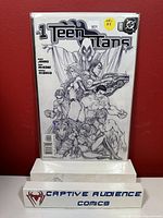 Front of Teen Titans #1 comic book with black and white sketch variant cover featuring multiple Teen Titans characters all in pencil sketch style, bagged and boarded.