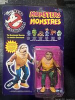 Full frontal image of the carded Quasimodo Monster action figure showing purple card and bubble with figure inside, with illustrated character on card.